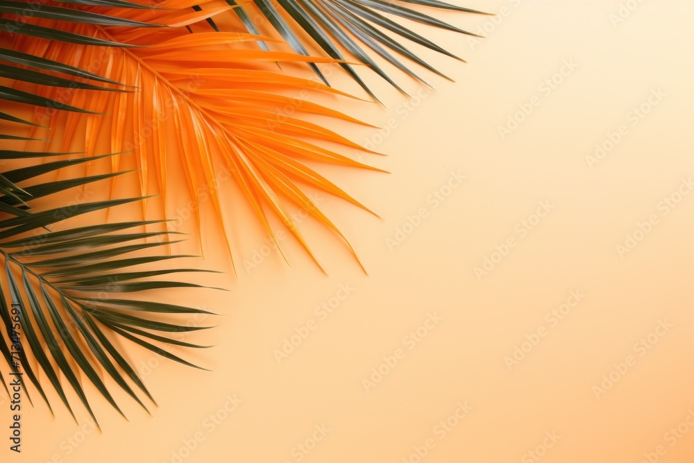  a close up of a palm leaf on a yellow background with a blurry image of a palm tree in the background.