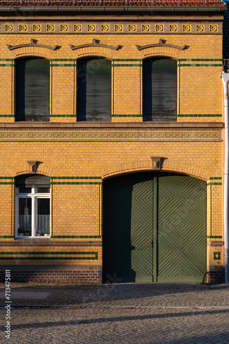 Ornate Yellow Brickwork on Historic Building in Treuenbrietzen, Germany photo