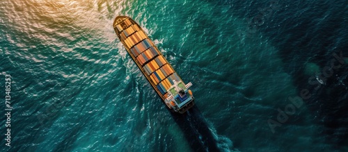 Aerial top view of International Containers Cargo ship in ocean Freight Transportation Shipping Nautical Vessel Logistics import export Container Cargo ship over sea OverseaTransport business
