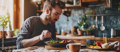A man eating a healthy morning meal breakfast at home Fit lifestyle. Copy space image. Place for adding text or design photo