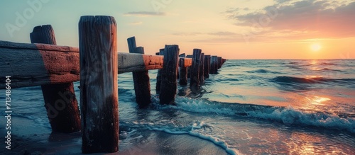beautiful sunset at the wooden jetty at the beach. Copy space image. Place for adding text or design