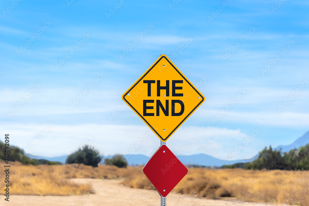 The End street sign in the Mojave Desert with blue sky The End street sign in the Mojave Desert with blue sky