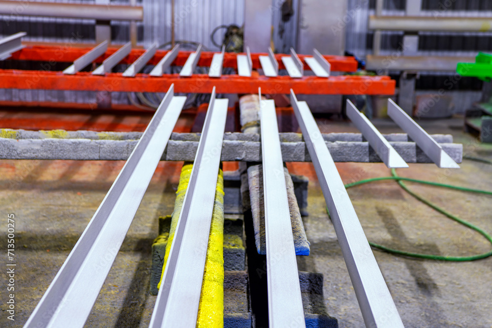 Metal profile corner in selective focus is designed for construction work in a paint shop.Production and sale of metal structures. Metal profile corner in selective focus is designed for construction work in a paint shop.Production and sale of metal structures.