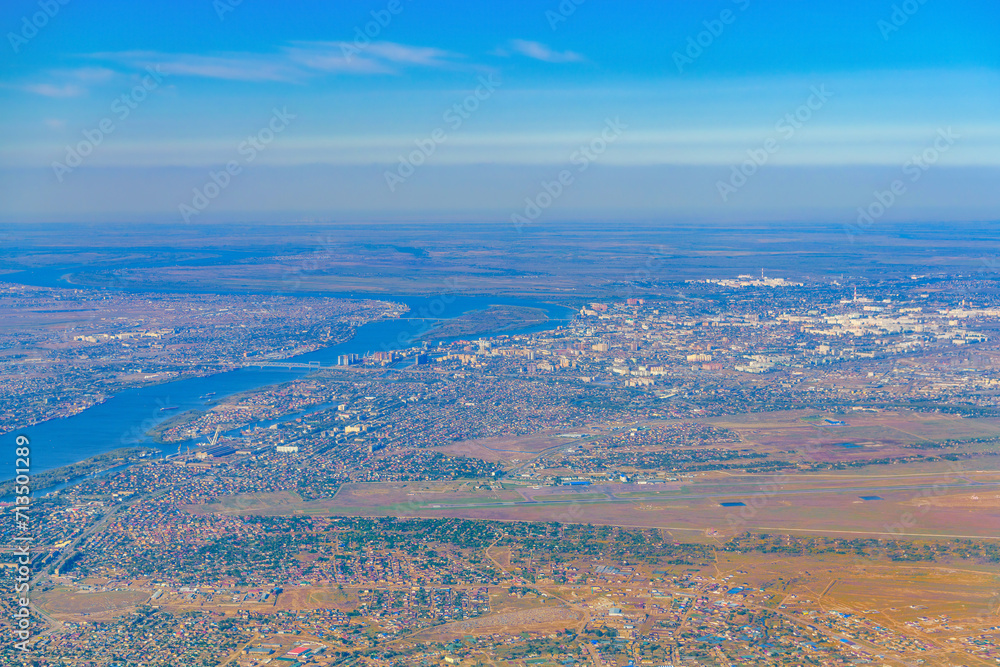 Aerial view of Astrakhan city, Russia out of focus seen from an airplane.