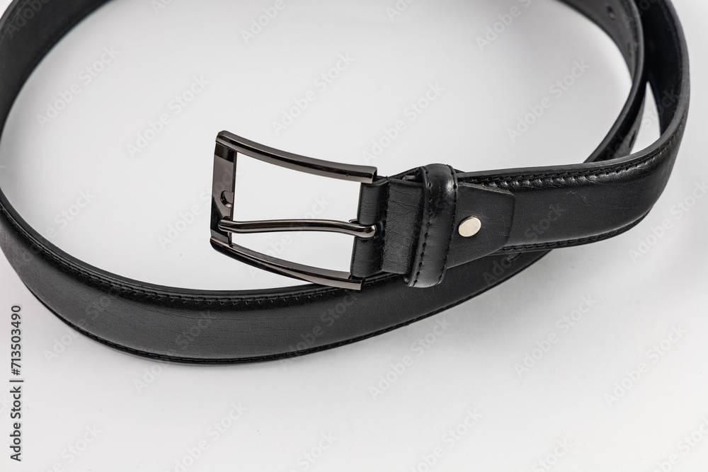 Long and wide black leather belt with few small holes and metallic big buckle Long and wide black leather belt with few small holes and metallic big buckle