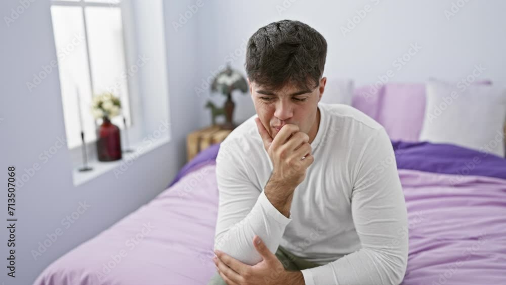 Anxious young hispanic man, stressed and biting nails in bedroom, embodies fear and nervousness Anxious young hispanic man, stressed and biting nails in bedroom, embodies fear and nervousness