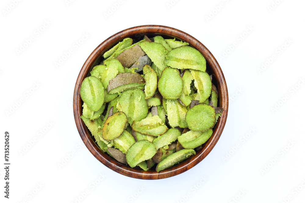 Terminalia bellirica or baheda Fruits sliced in a wooden bowl top view Terminalia bellirica or baheda Fruits sliced in a wooden bowl top view