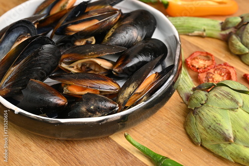 overhead view of cooked mussels in shells 