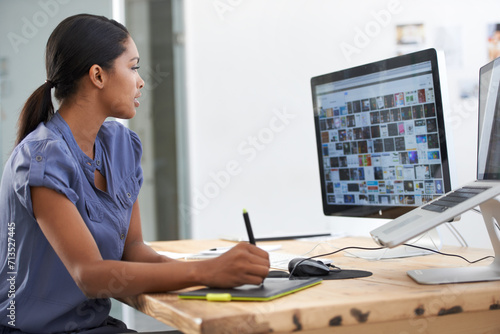 Business woman, computer screen and editing tablet, sketch pen or planning for creative project or social media. Young graphic designer with images and digital of catalog or website asset management photo