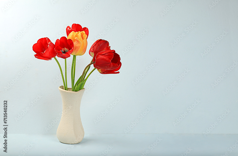 Abstract floral composition, Home interior with beautiful spring tulips in a vase, banner, still life with space for text, floral holiday greeting car Abstract floral composition, Home interior with beautiful spring tulips in a vase, banner, still life with space for text, floral holiday greeting car