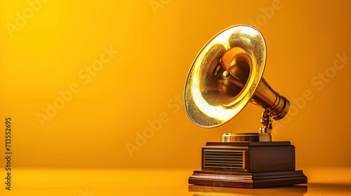 A vintage gramophone on a golden backdrop, a classic emblem of the rich history of music and its timeless appeal. photo