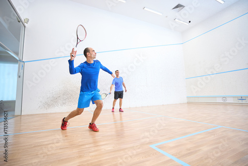 Athletic men practicing squash together sport and active lifestyle