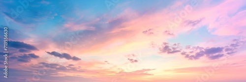 Background of colorful sky concept: Dramatic sunset with twilight color sky and clouds, panorama.