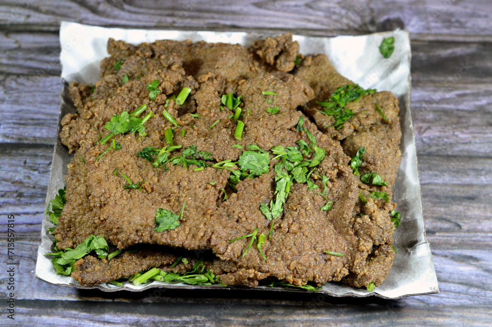 Traditional Arabic deep fried beef liver slices, beef liver covered