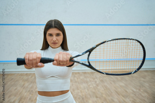 Beautiful and athletic woman with squash racket © Viacheslav Yakobchuk