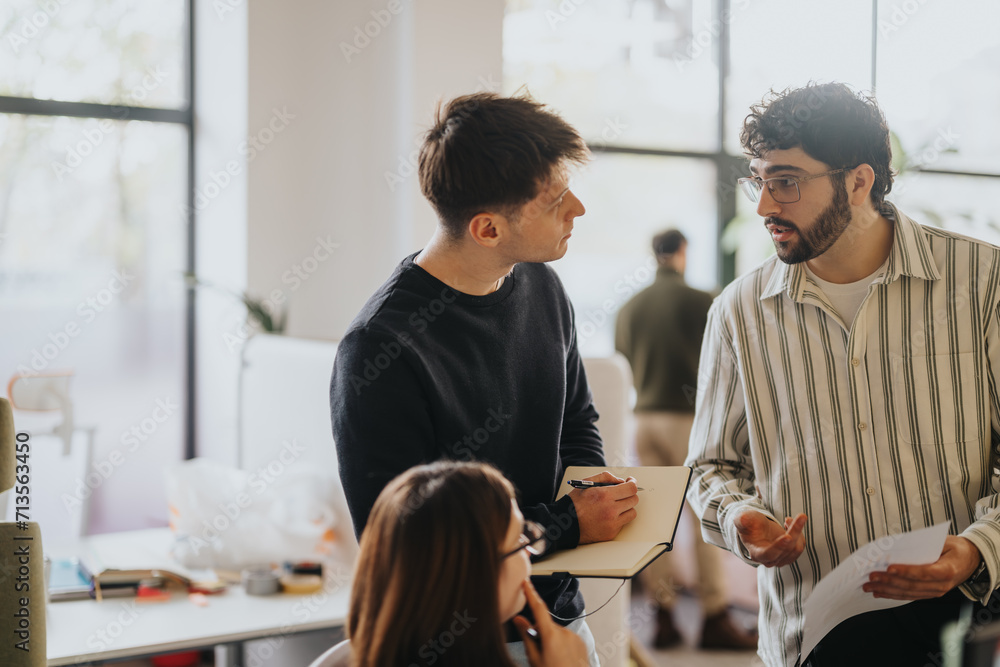 Diverse business professionals collaborating on market analysis and project development in a creative office environment. Diverse business professionals collaborating on market analysis and project development in a creative office environment.