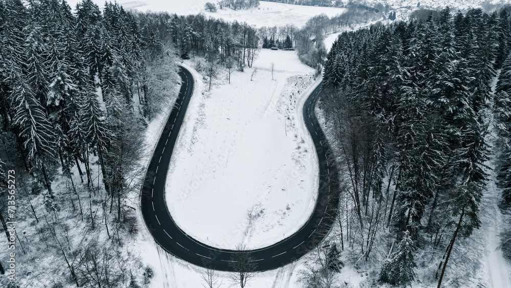 Winter Wonderland Aerial View: Snowy Streets Captured by Drone