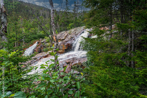 Southeast Brook Falls in Gros Morne National Park, a Canadian national park and World Heritage Site in Newfoundland. Stream flows over billion-year-old ridge of resistant granite and plunges 40 metres photo