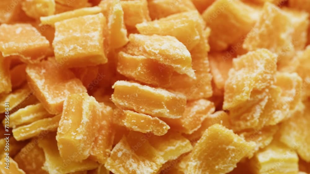 Candied fruits from an orange rotating close-up macro. Citrus dried fruits in sugar Candied fruits from an orange rotating close-up macro. Citrus dried fruits in sugar