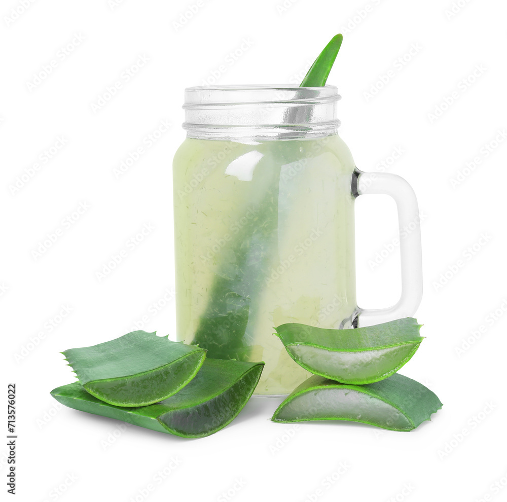 Tasty aloe juice in mason jar and cut leaves isolated on white Tasty aloe juice in mason jar and cut leaves isolated on white