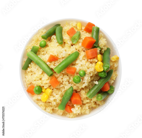Delicious bulgur with vegetables in bowl isolated on white, top view