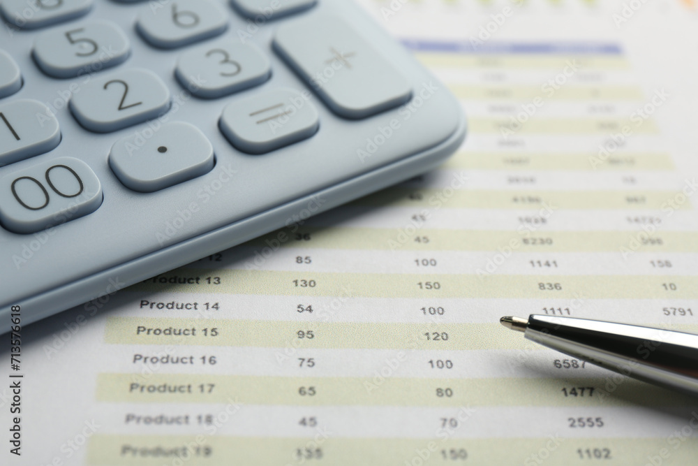Calculator and pen on accounting document with data, closeup Calculator and pen on accounting document with data, closeup