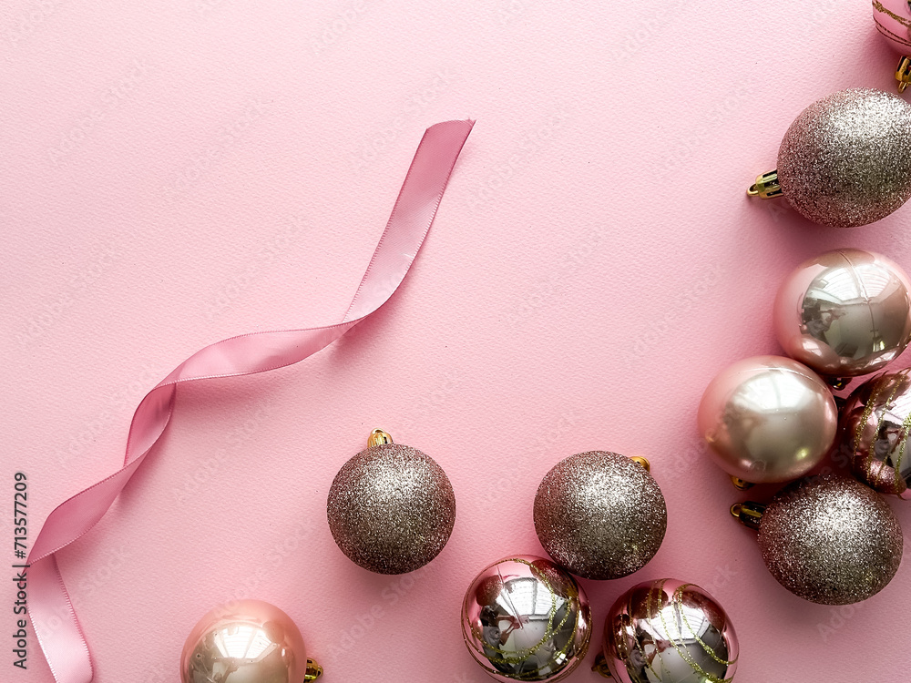 New Year's balls on pink background, with space for text 