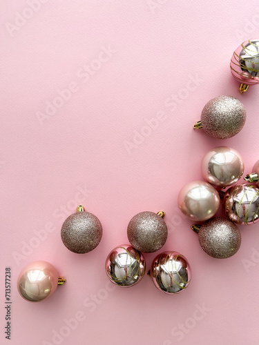 New Year's balls on pink background, with space for text 