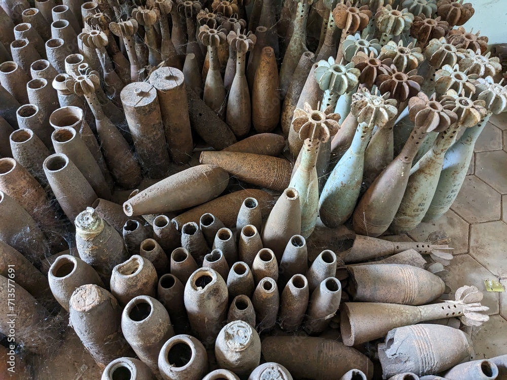 Fototapeta premium unexploded land mines and cluster bombs remains picked up all around Cambodia after war,now set in Museum of landmines in Siem Reap Cambodia, huge amount of ammunition is still laying in countryside