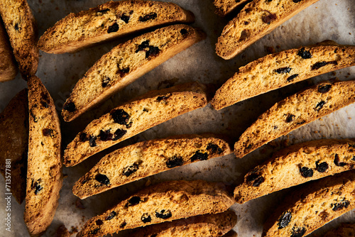 Golden Biscotti or Cantuccini on the baking pan. Traditional Sweet Italian cookies that are making with two times baking, with nuts and dried cranberries. Extra crunchy and dry. Top view