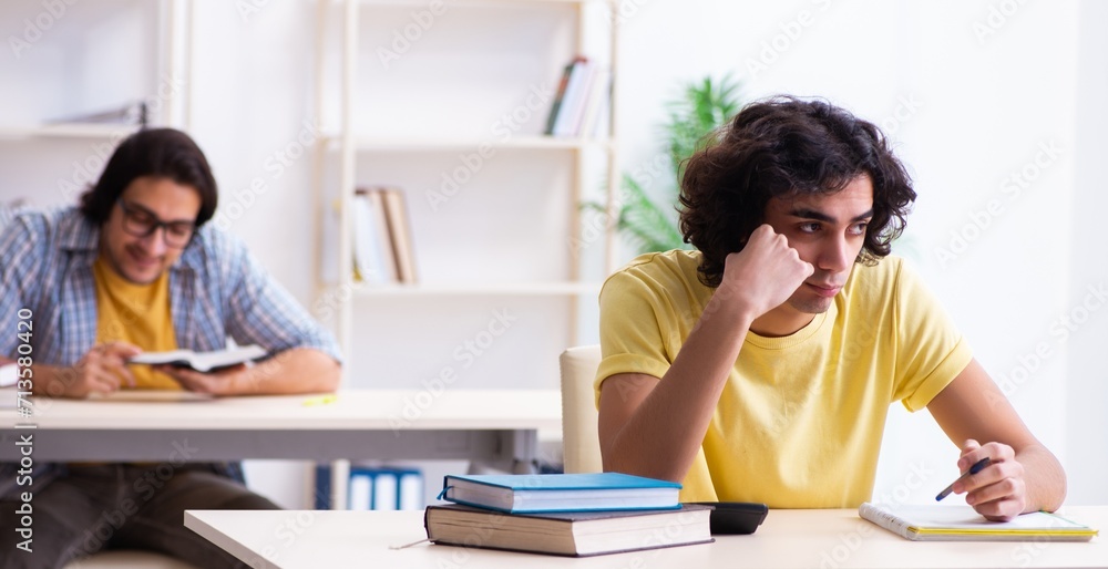Two male students in the classroom Two male students in the classroom