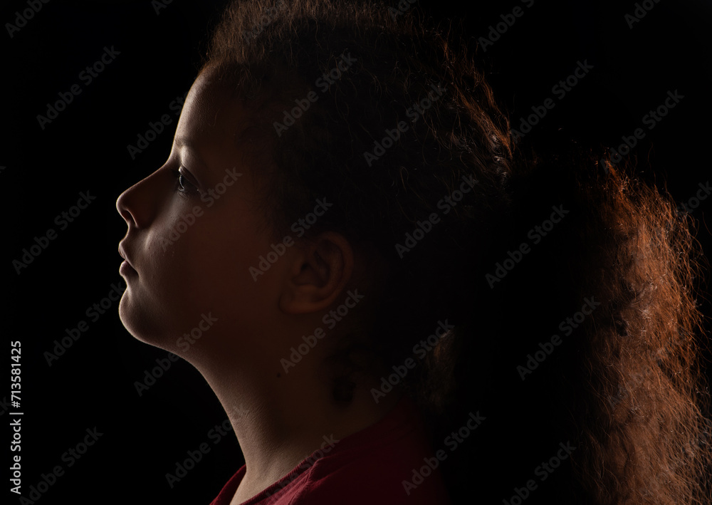 Photo of young girl, a beautiful low key photo of a beautiful girl from Brazil, selective focus.