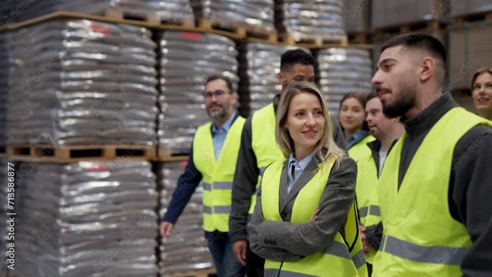 Full team of warehouse employees walking in warehouse. Team of workers, managers, female director in modern industrial factory, heavy industry, manufactrury. Full team of warehouse employees walking in warehouse. Team of workers, managers, female director in modern industrial factory, heavy industry, manufactrury.