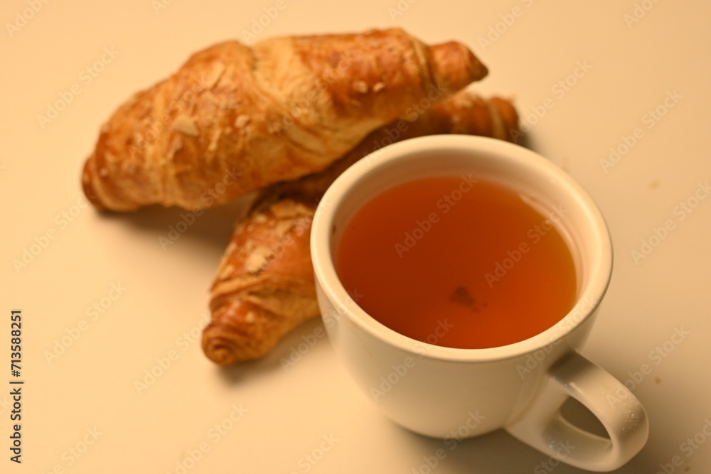 black tea and croissants, cup of tea and croissants, breakfast concept black tea and croissants, cup of tea and croissants, breakfast concept