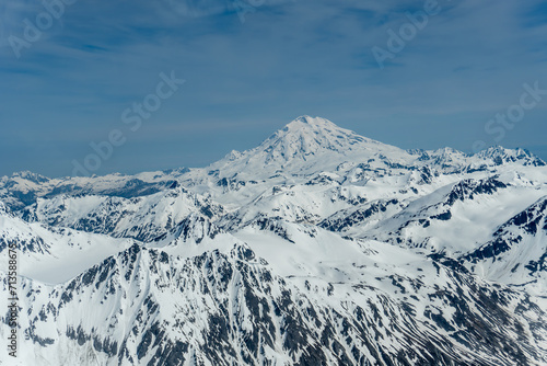 liamna Volcano, or Mount Iliamna glacier covered stratovolcano in Aleutian Range of southwest Alaska. Chigmit Mountain subrange in Lake Clark National Park and Preserve. photo