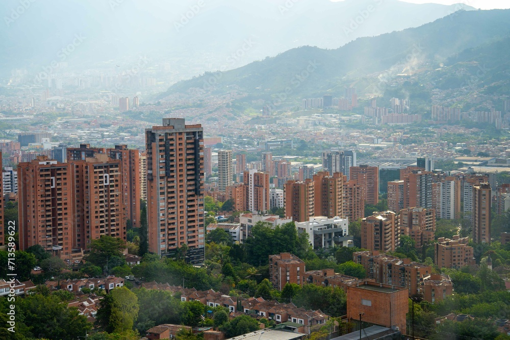 urban cityscape of poblado medellin during a bright and cloudy day
