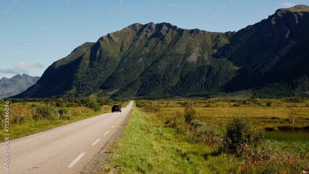 Black Car Travelling On Country Road