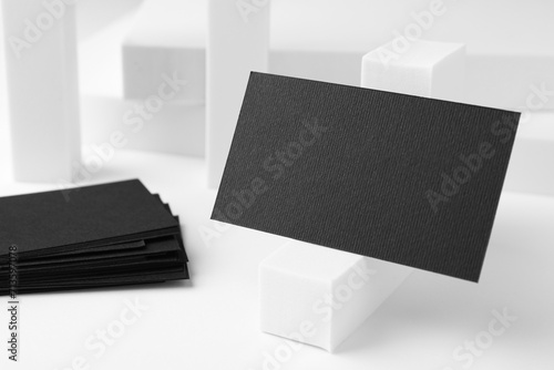 Blank black business cards on white background. Mockup for design