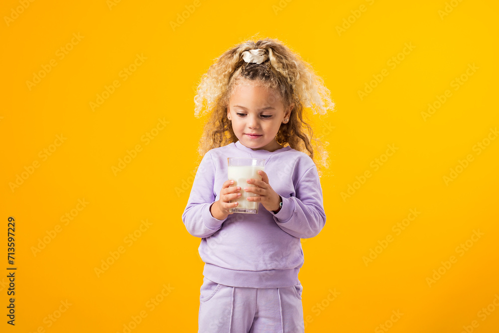 Happy Child Girl Holding a Glass of Milk . A Heartwarming Image of Innocence and Healthy Delight Happy Child Girl Holding a Glass of Milk . A Heartwarming Image of Innocence and Healthy Delight