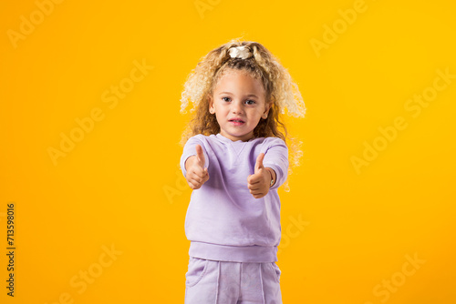 Child Girl Expressing Positivity with a Thumbs-Up Gesture ? Encouraging Success and Uplifting Vibes