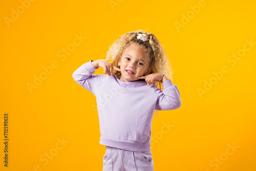 Smiling Child Girl, Expressing Joy, Playfulness, and Pure Delight
