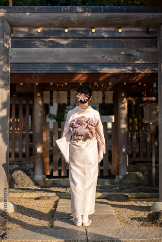 Japanese Kimono Portrait back view photography. Kyoto, Japan. Japanese traditional Shrine Torii.