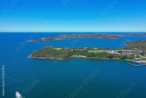 High angle aerial drone view of Cobblers Beach and Middle Head in the suburb of Mosman, Sydney, New South Wales, Australia. South Head and suburb Vaucluse in the background.