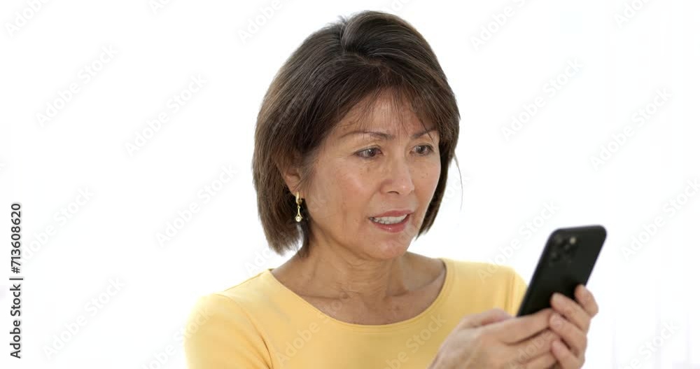 Closeup happy attractive woman smiling enjoying looking at mobile phone texting reading email messages isolated. Closeup happy attractive woman smiling enjoying looking at mobile phone texting reading email messages isolated.