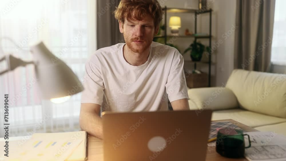 Handsome freelancer working on laptop checking email surfing web indoors Concentrated young man student having online distance education or work on computer and looking at screen at home workplace Handsome freelancer working on laptop checking email surfing web indoors Concentrated young man student having online distance education or work on computer and looking at screen at home workplace