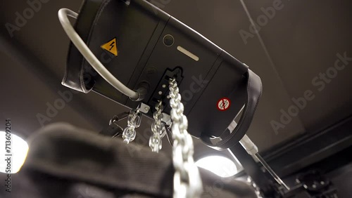 Steadicam Close Up Rotating Shot of Chain Going Down From Electric Ceiling Chain Hoist