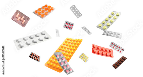 Many flying blister packs with pills on white background