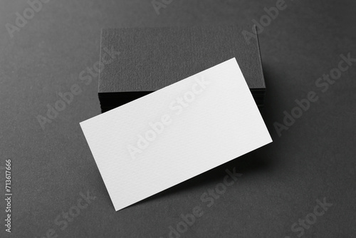 Blank business cards on black background, closeup. Mockup for design © New Africa