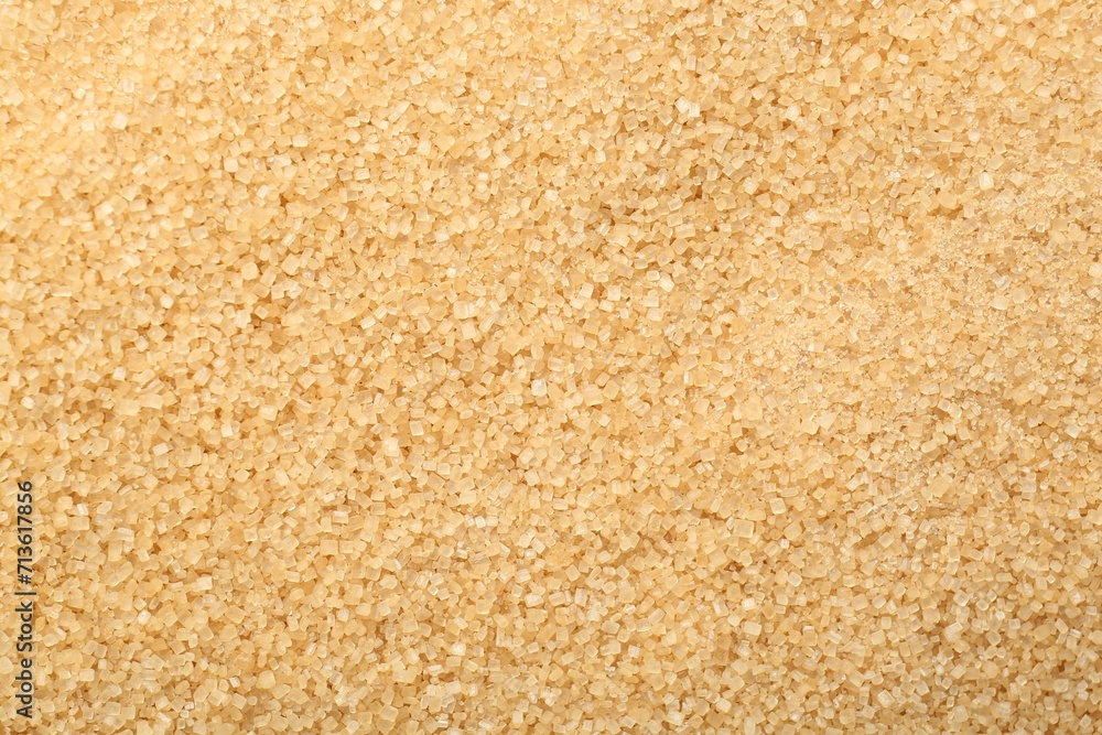 Granulated brown sugar as background, top view Granulated brown sugar as background, top view