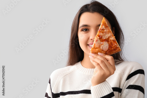 Young woman with piece of t...
